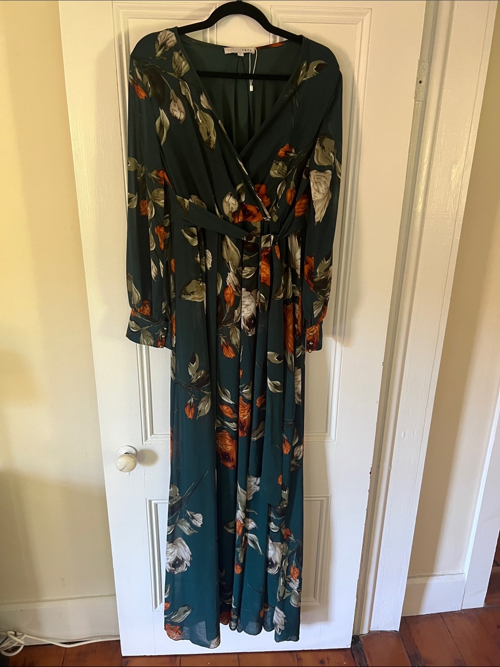 Floral Wrap gown in Deep Green with brushed gold dome buttons at cuff.